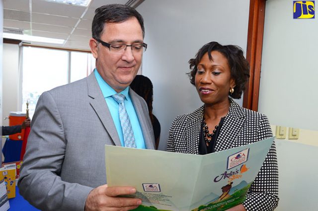 Children’s Advocate, Diahann Gordon Harrison (right), shares details of ‘Aria’s Story’ with High Commissioner of Canada to Jamaica, His Excellency Sylvan Fabi, prior to the recent launch at the Office of the Children’s Advocate (OCA) in downtown Kingston. The public-education campaign, which is an initiative of the OCA, is an online animated miniseries being rolled out across various social media platforms.