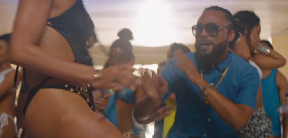 Machel Montano dancing with a lady for his music video Fast Wine