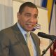 Prime Minister, the Most Hon. Andrew Holness talking in a microphone about pension fund