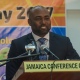 Andrew Wheatley, delivers greetings at the e-Learning Jamaica Technology Day on tablets