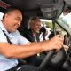 Christopher Tufton, tries out one of the six ambulances at May Pen Hospita