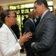 Prime minister holness taking with IBD manager about e-Governance captured by Vision newspaper Caribbean news