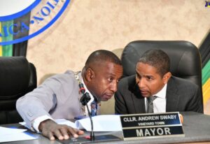 Mayor of Kingston, Councillor Andrew Swaby (left) consults with Deputy Mayor, Senator Councillor Delroy Williams during Tuesday’s (April 9) sitting of the Kingston and St. Andrew Municipal Corporation’s monthly meeting held at 24 Church Street in downtown Kingston. (image source: JIS)