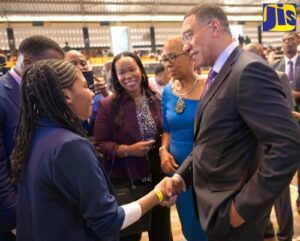 Prime Minister, the Most Hon. Andrew Holness (right), greets 14-year-old University of Technology (UTech) student, Jada Wright (left), during the Future Ready International Conference at the UTech campus in Kingston on April 24. Looking on are Permanent Secretary in the Ministry of Education and Youth, Dr. Kasan Troupe; and Portfolio Minister, Hon. Fayval Williams (right). (image source: JIS)