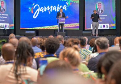 Prime Minister the Most Hon. Andrew Holness addresses the Future Ready International Conference held at the University of Technology (UTECH) Jamaica in Kingston on April 24. At right is sign language interpreter, Antoinette Aiken.