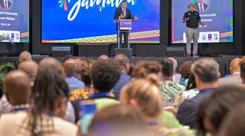 Prime Minister the Most Hon. Andrew Holness addresses the Future Ready International Conference held at the University of Technology (UTECH) Jamaica in Kingston on April 24. At right is sign language interpreter, Antoinette Aiken.
